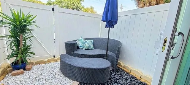 a view of a utility room with dryer and door