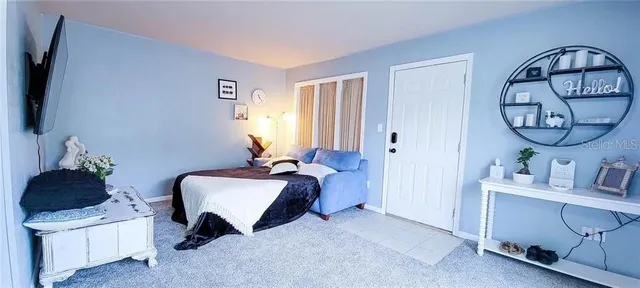 a living room with furniture and a window