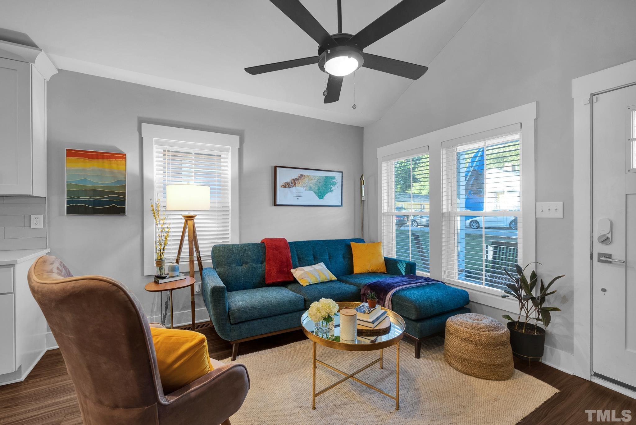 107 Bart Street Raleigh, NC 27610 - Photo 2 of 20 a living room with furniture and a potted plant
