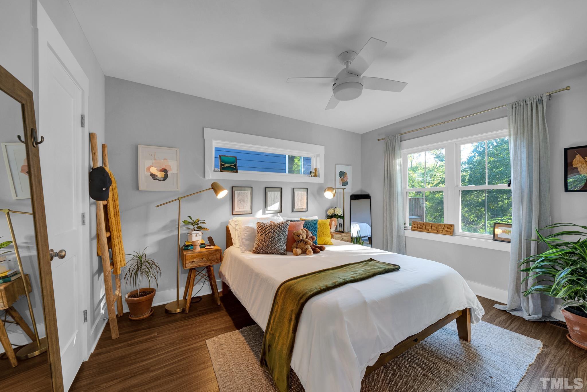 107 Bart Street Raleigh, NC 27610 - Photo 11 of 20 a bedroom with a bed wooden floor and a window
