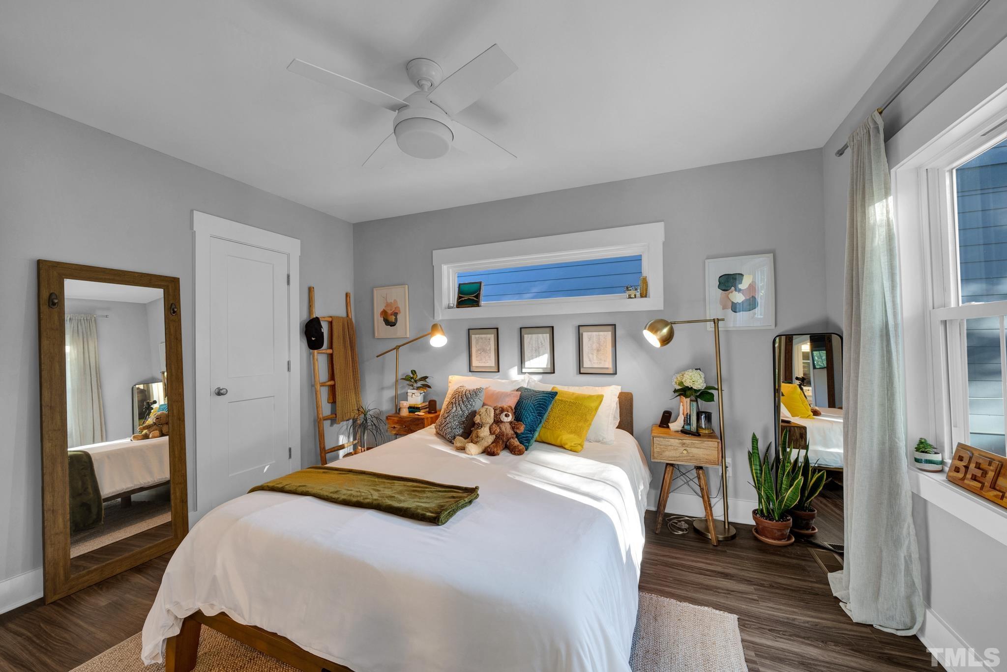 107 Bart Street Raleigh, NC 27610 - Photo 12 of 20 a bedroom with a bed and wooden floor