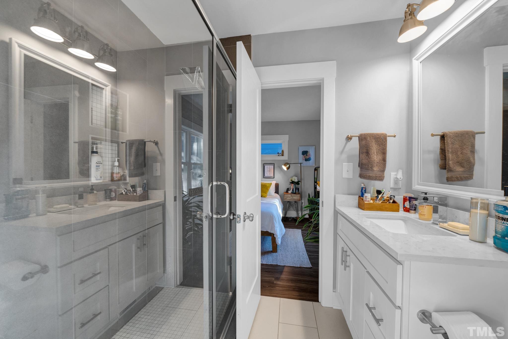 107 Bart Street Raleigh, NC 27610 - Photo 13 of 20 a bathroom with a sink double vanity and a mirror