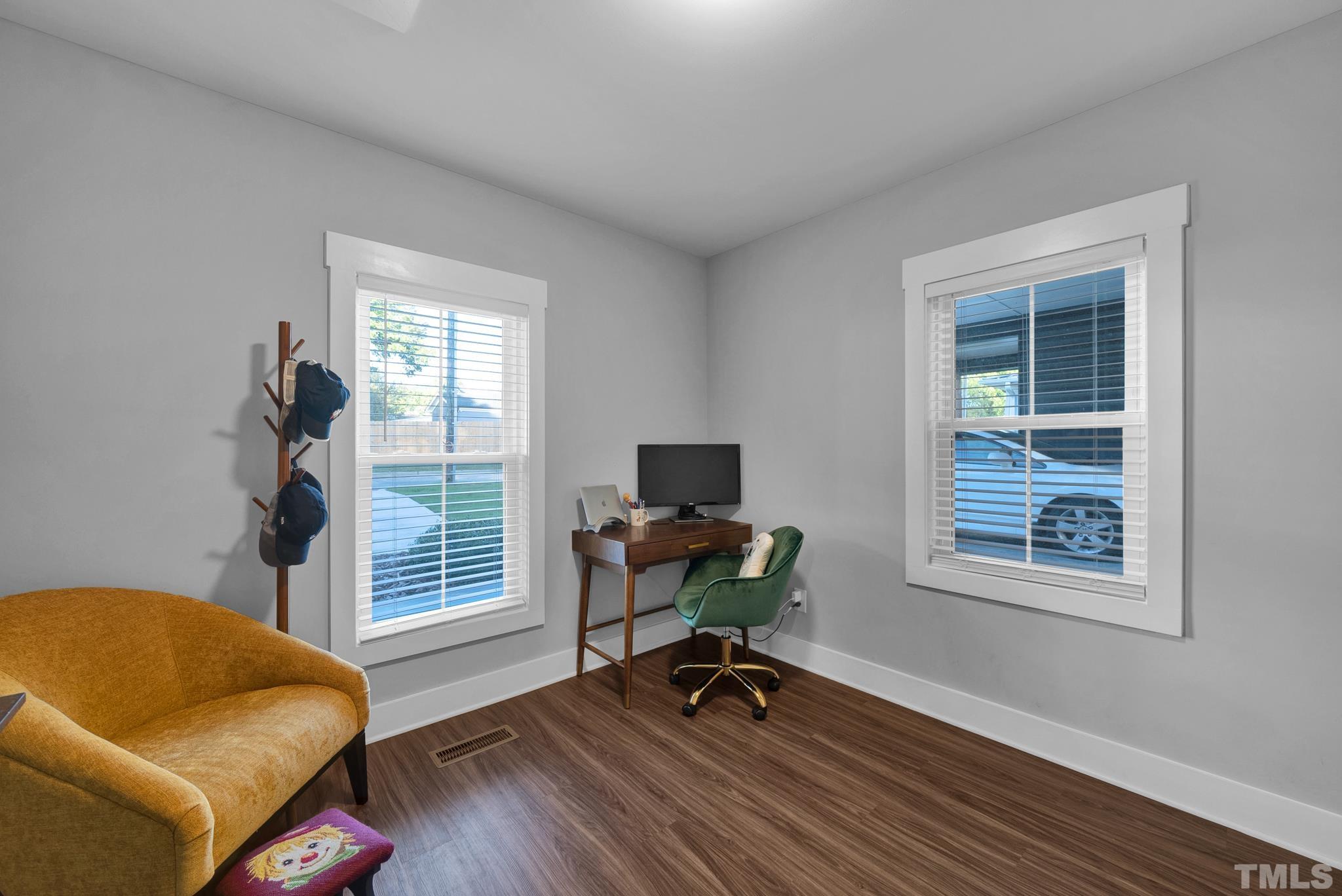 107 Bart Street Raleigh, NC 27610 - Photo 9 of 20 a view of a livingroom with workspace and a window