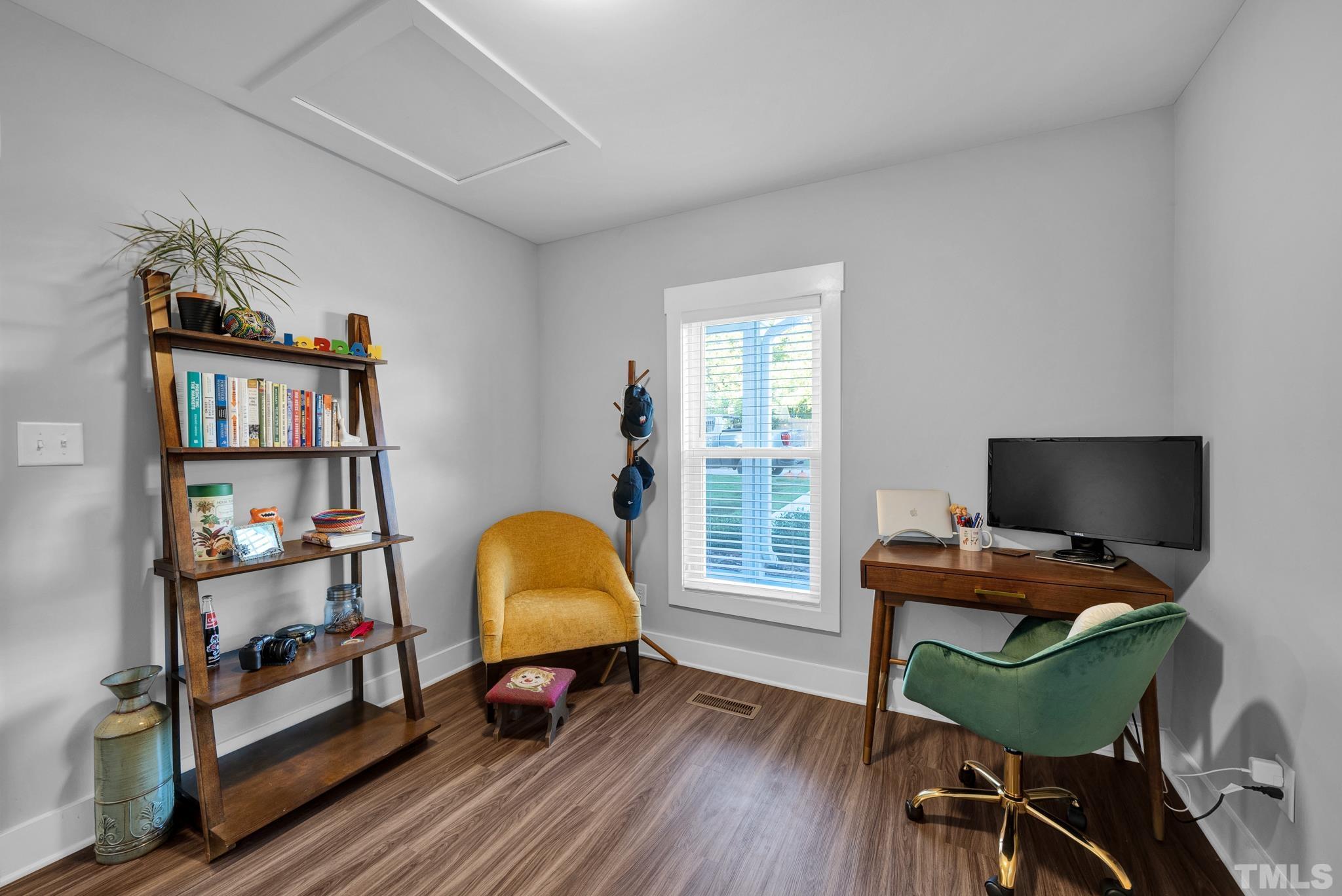 107 Bart Street Raleigh, NC 27610 - Photo 10 of 20 a view of a workspace with furniture and a window