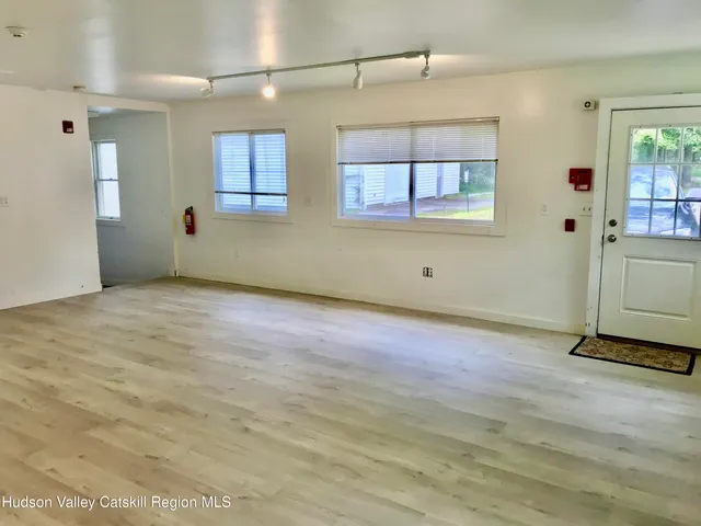 a view of an empty room with a window