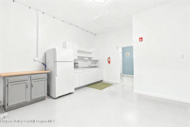 a utility room with cabinets washer and dryer