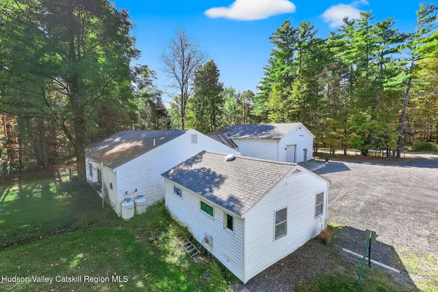 a aerial view of a house with a yard