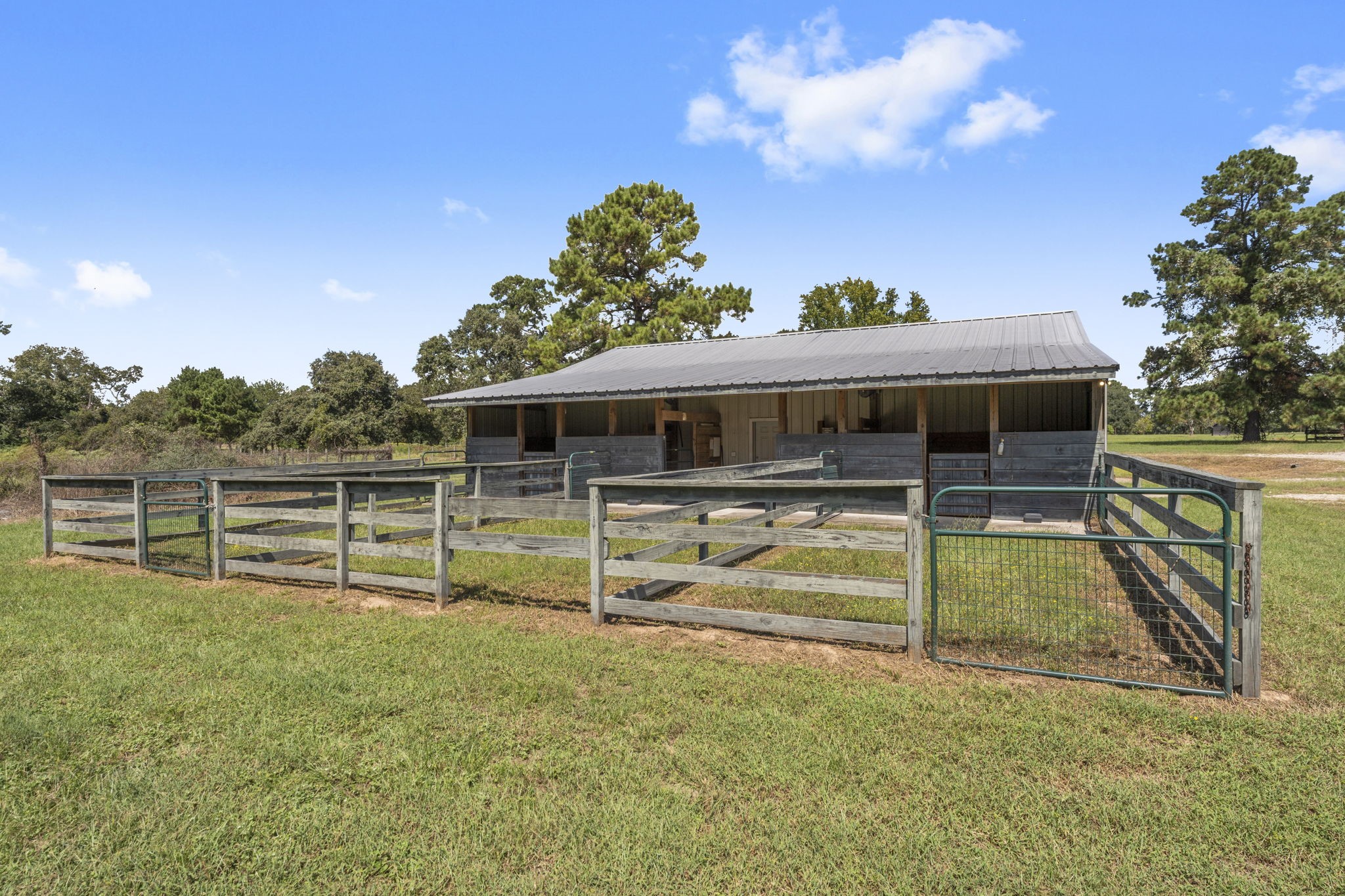 1534 Virgie Community Road Magnolia, TX 77354 - Photo 45 of 50 The horse stalls and runs of the 60'x50' workshop.
