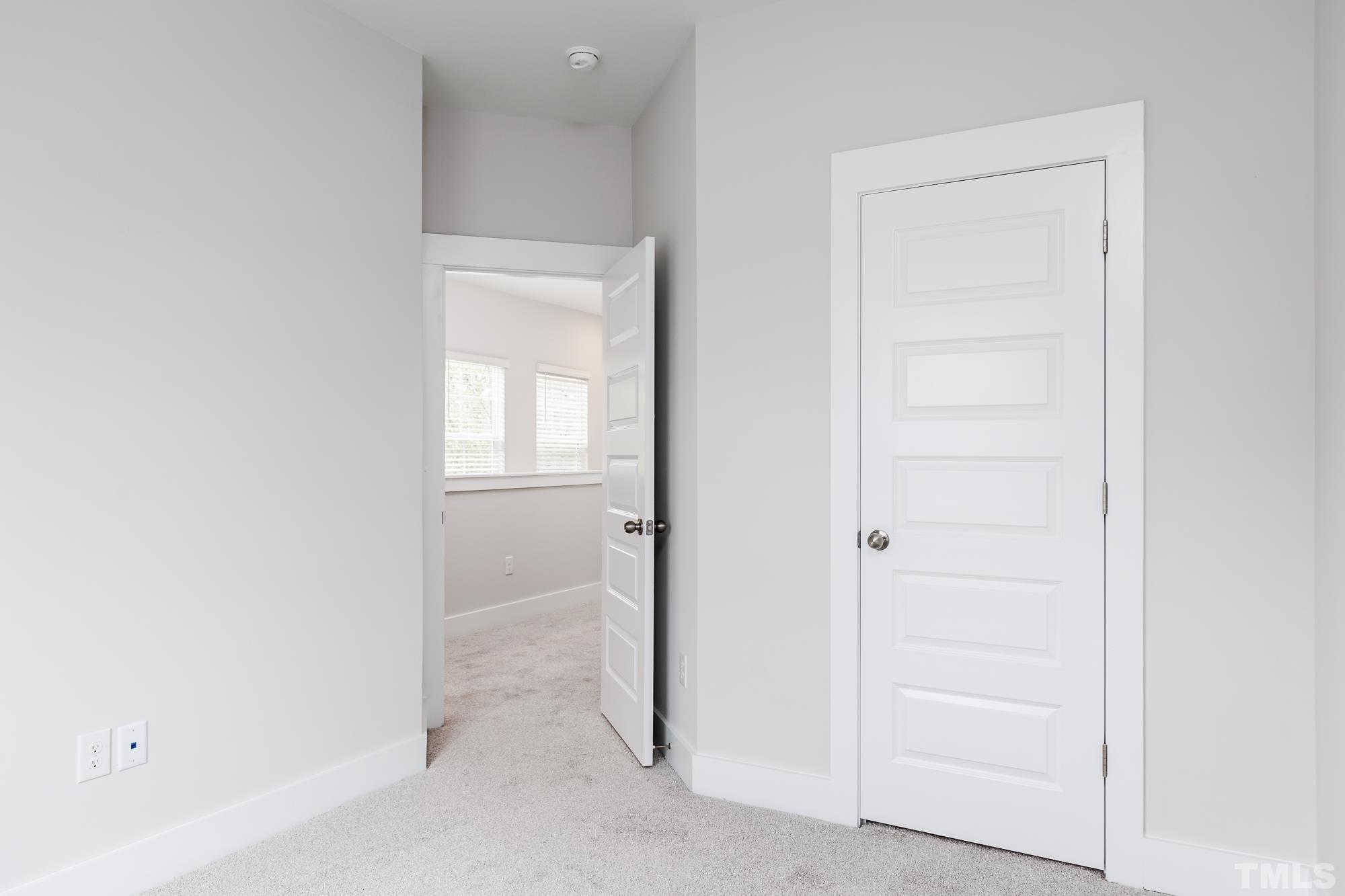 8514 Silsbee Drive Raleigh, NC 27613 - Photo 17 of 18 an empty room with windows