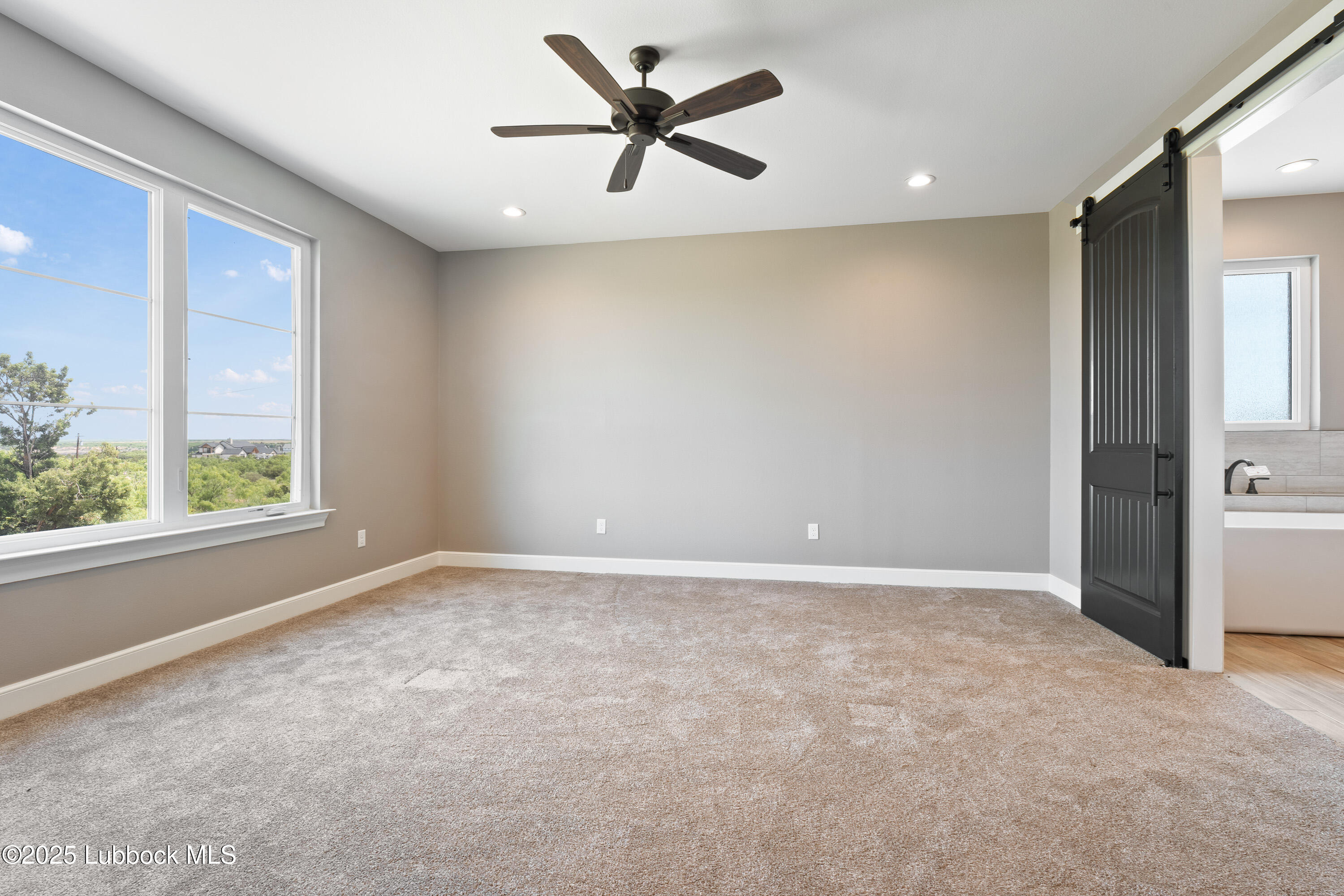 110 Ward Road Snyder, TX 79549 - Photo 12 of 37 a view of an empty room with a window