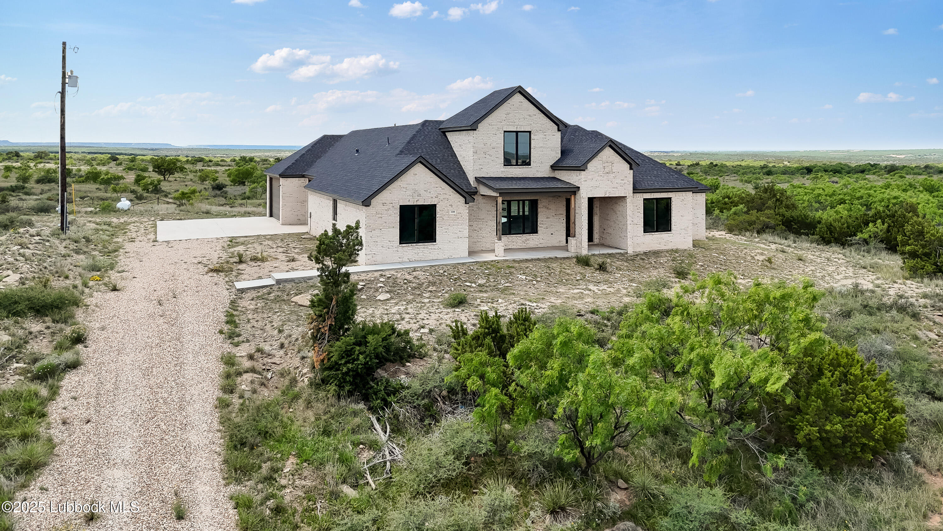 110 Ward Road Snyder, TX 79549 - Photo 2 of 37 a house with trees in the background