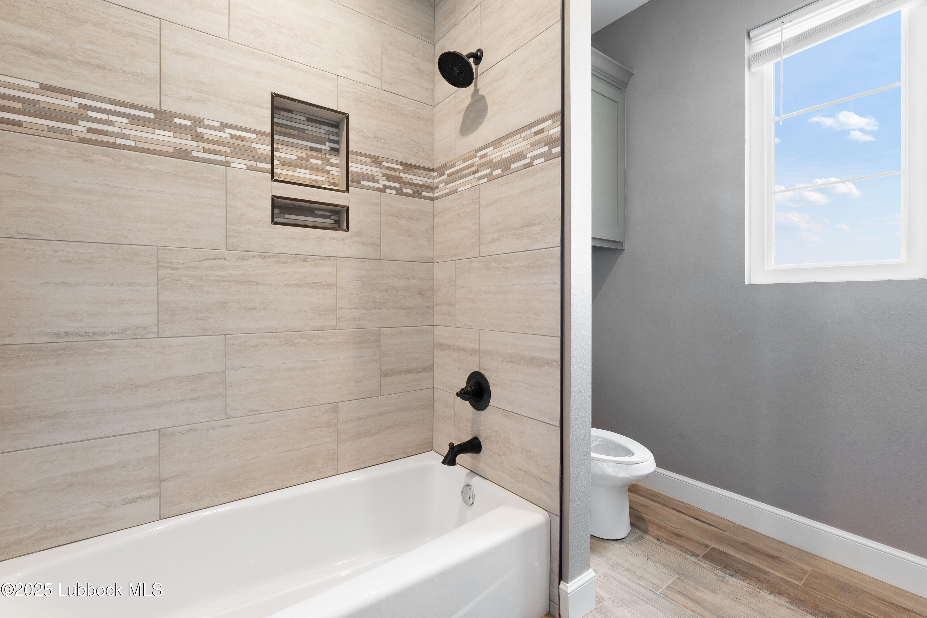 110 Ward Road Snyder, TX 79549 - Photo 22 of 37 a bathroom with a bathtub and a shower