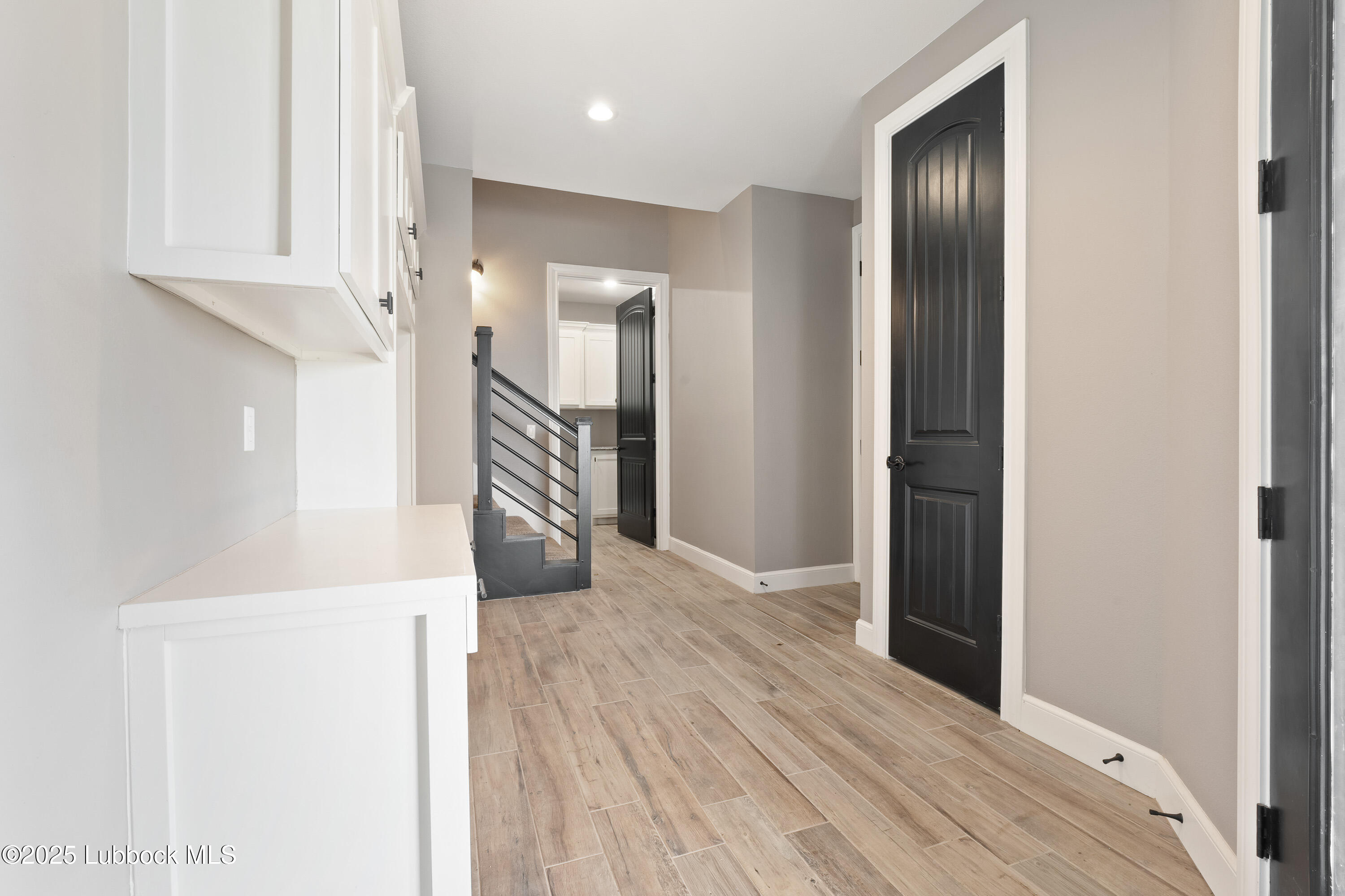110 Ward Road Snyder, TX 79549 - Photo 26 of 37 a view of a hallway with wooden floor