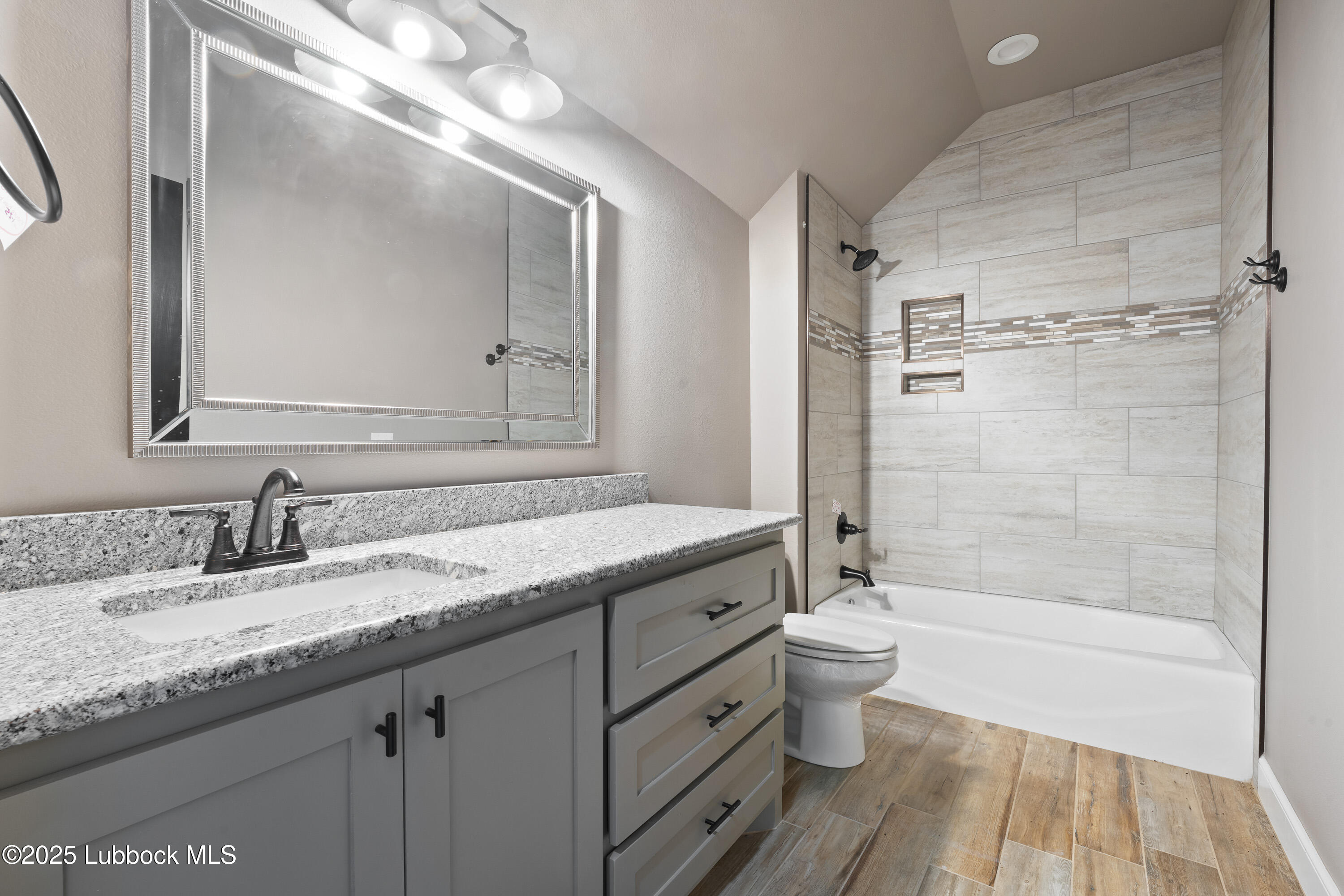 110 Ward Road Snyder, TX 79549 - Photo 30 of 37 a bathroom with a granite countertop sink toilet and shower