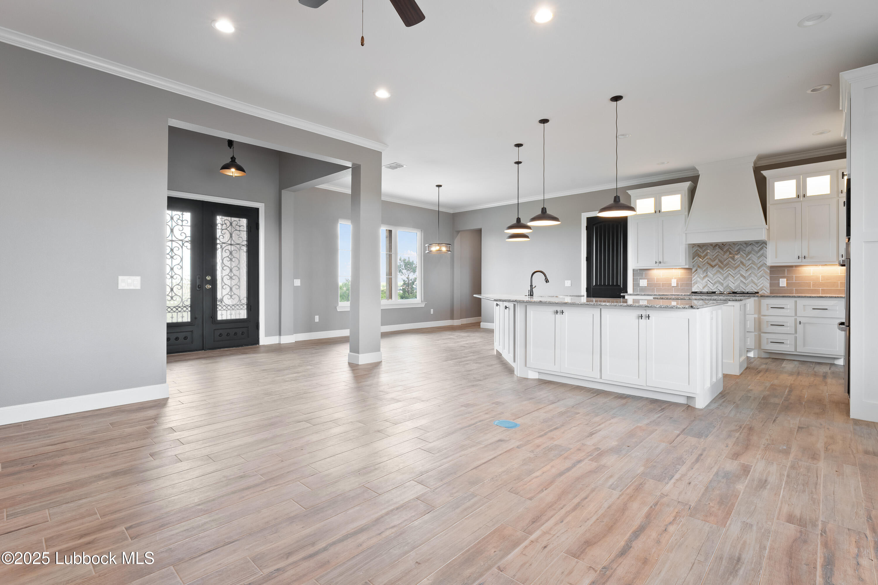 110 Ward Road Snyder, TX 79549 - Photo 5 of 37 a view of a kitchen with a sink and a refrigerator