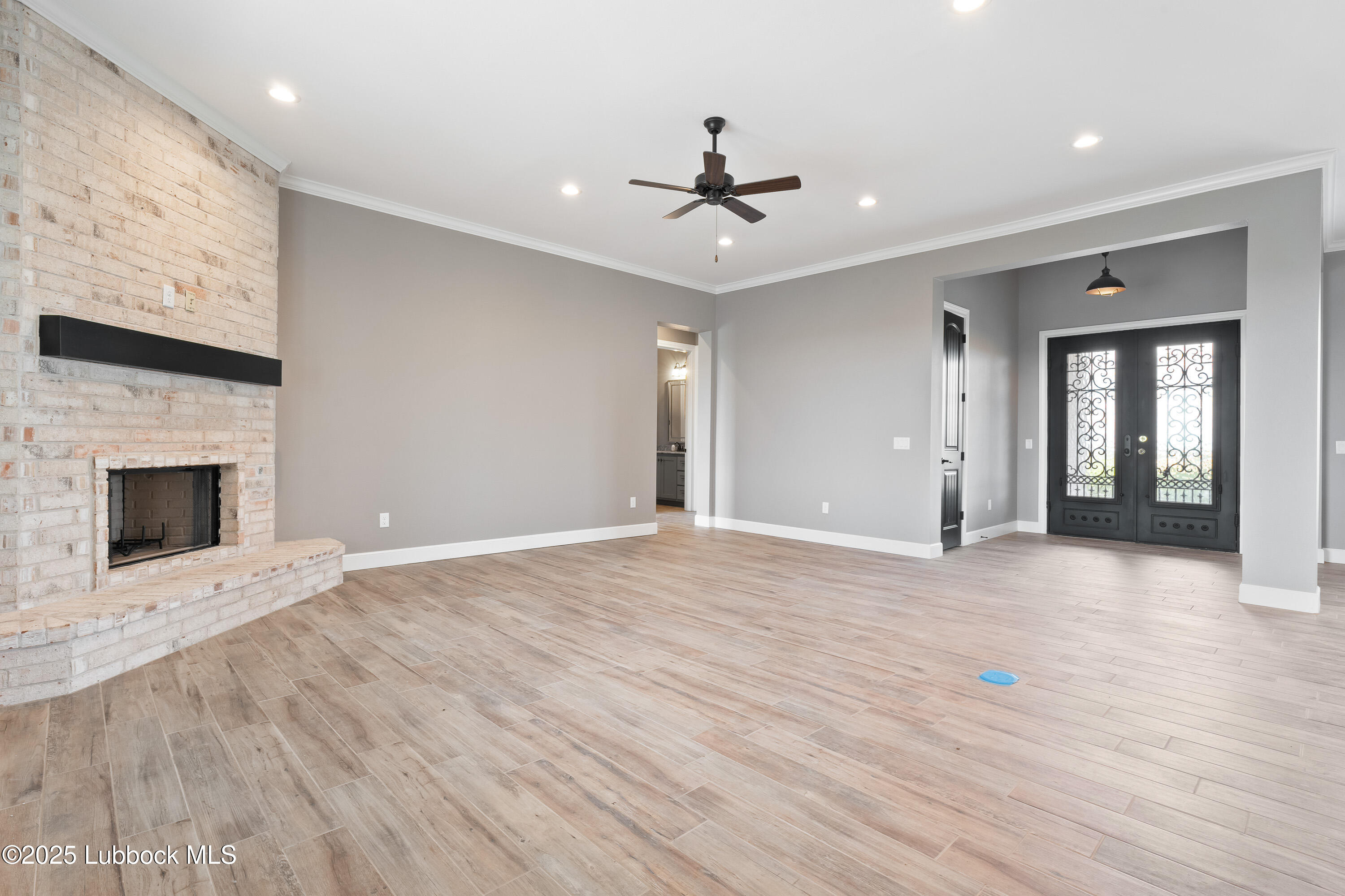 110 Ward Road Snyder, TX 79549 - Photo 6 of 37 a view of an empty room with window and fire place