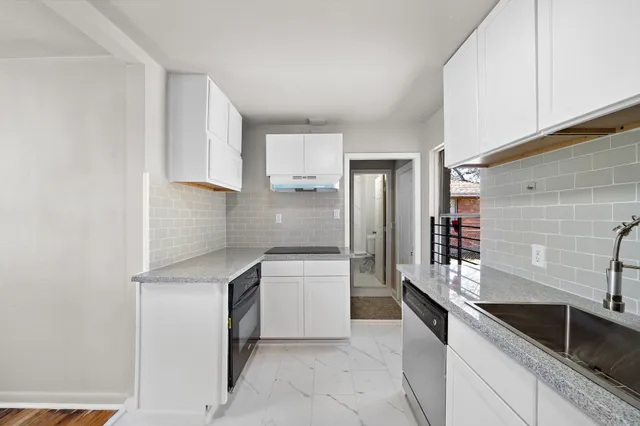a kitchen with a sink and refrigerator
