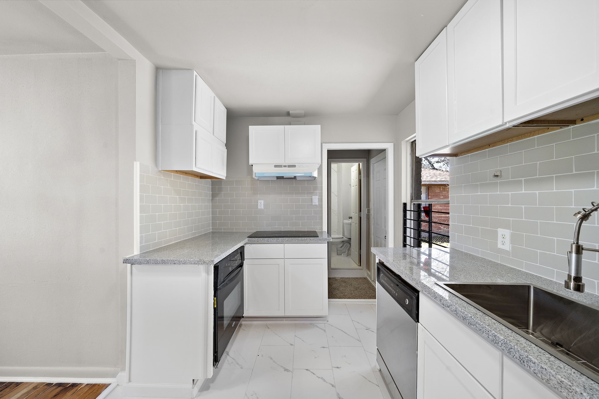 3121 Chimira Lane Houston, TX 77051 - Photo 15 of 35 a kitchen with a sink and refrigerator