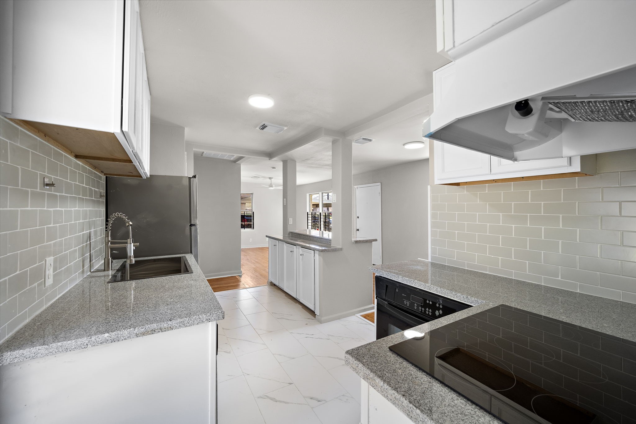 3121 Chimira Lane Houston, TX 77051 - Photo 16 of 35 a kitchen with stainless steel appliances granite countertop a sink and a stove