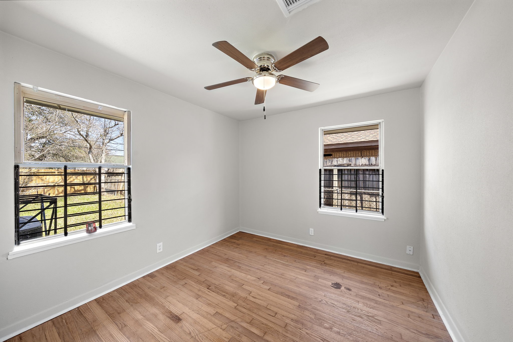 3121 Chimira Lane Houston, TX 77051 - Photo 29 of 35 a view of an empty room with wooden floor and a window