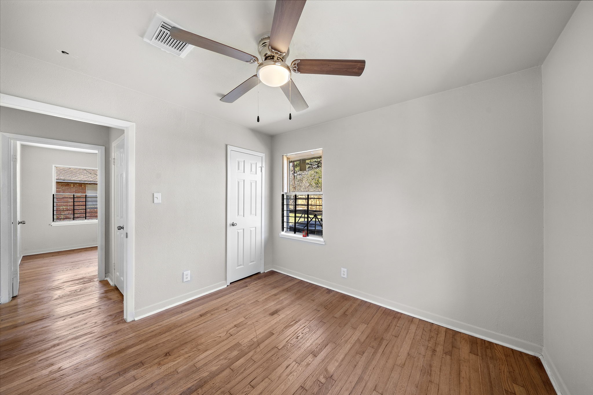 3121 Chimira Lane Houston, TX 77051 - Photo 30 of 35 wooden floor in an empty room with a window