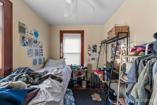 a bedroom with furniture and a closet