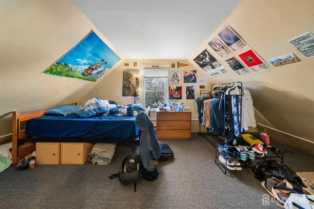 a room with gym equipment and a couch