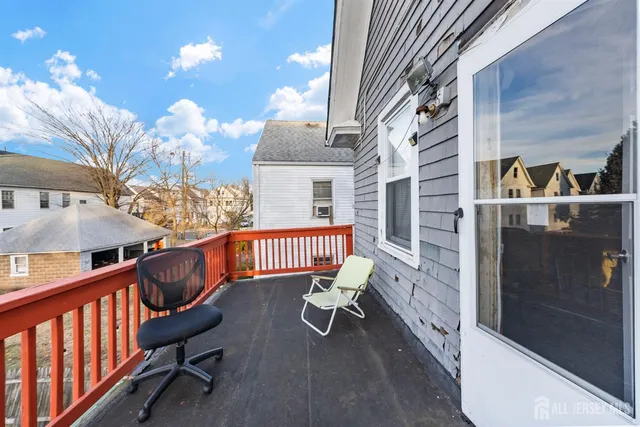 a balcony view with chairs