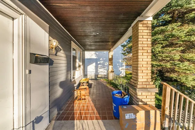 a view of balcony with wooden floor