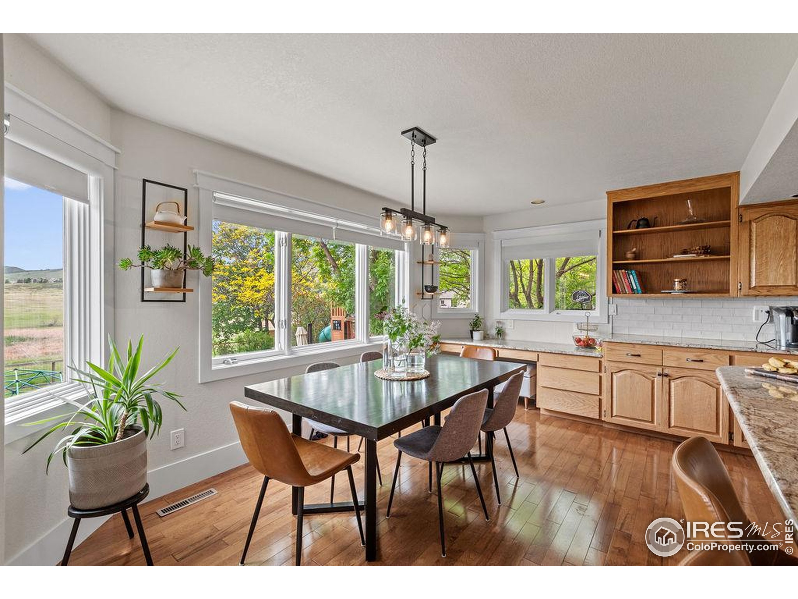 2213 Grosvenor Court Fort Collins, CO 80526 - Photo 11 of 40 a view of a dining room with furniture window and outside view