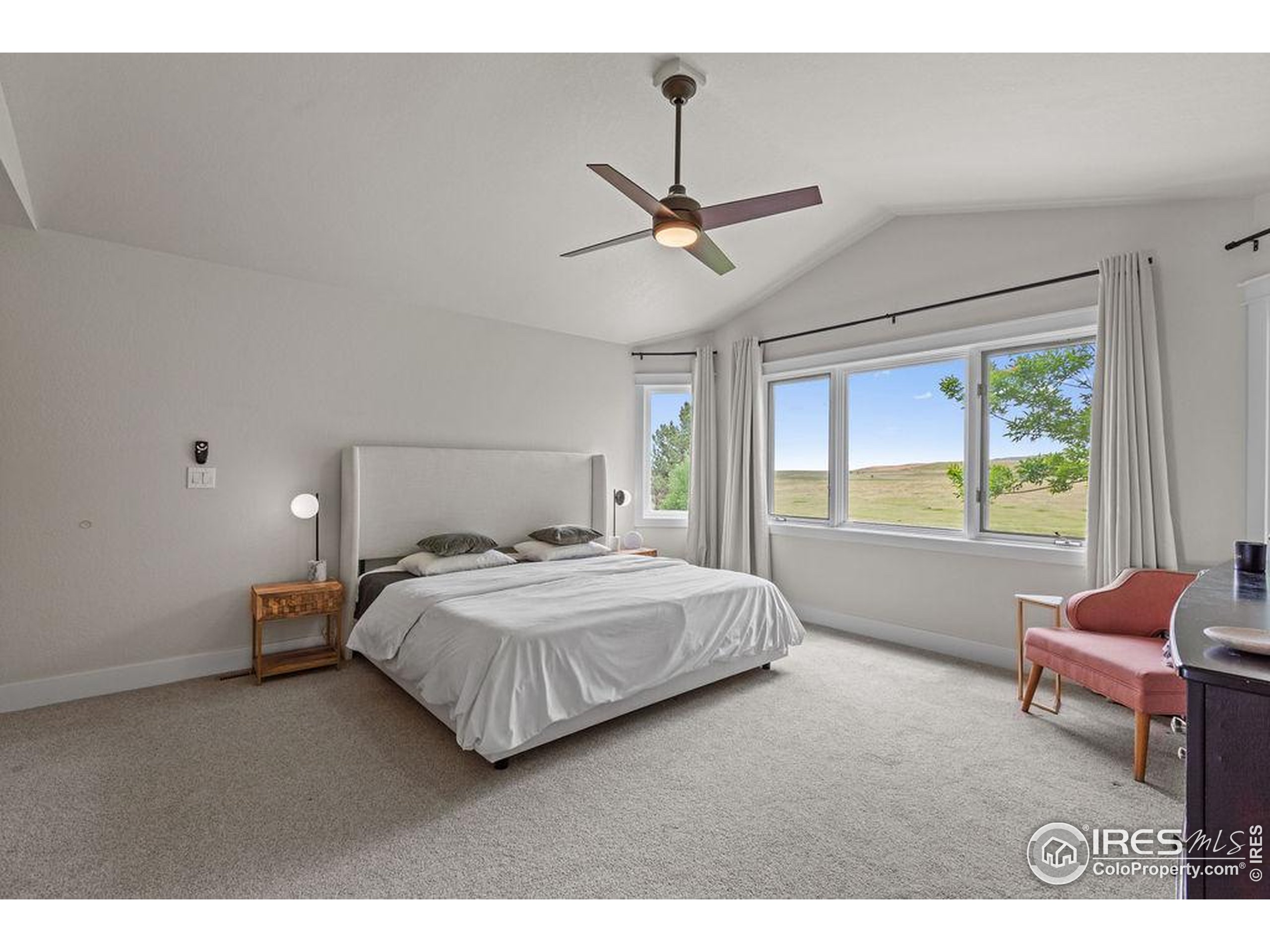 2213 Grosvenor Court Fort Collins, CO 80526 - Photo 20 of 40 a bedroom with a bed window and couch