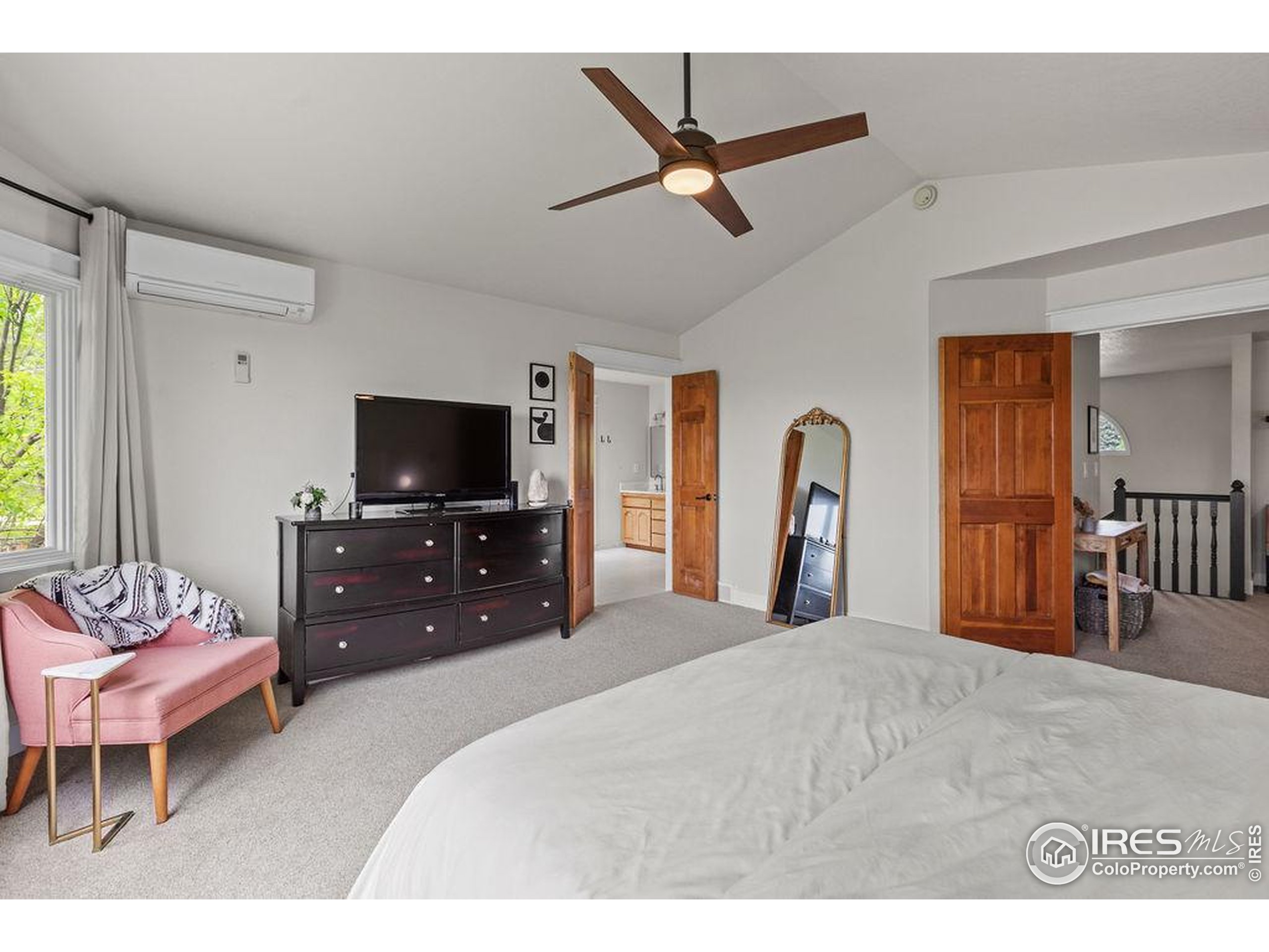 2213 Grosvenor Court Fort Collins, CO 80526 - Photo 21 of 40 a bedroom with a bed and a flat screen tv