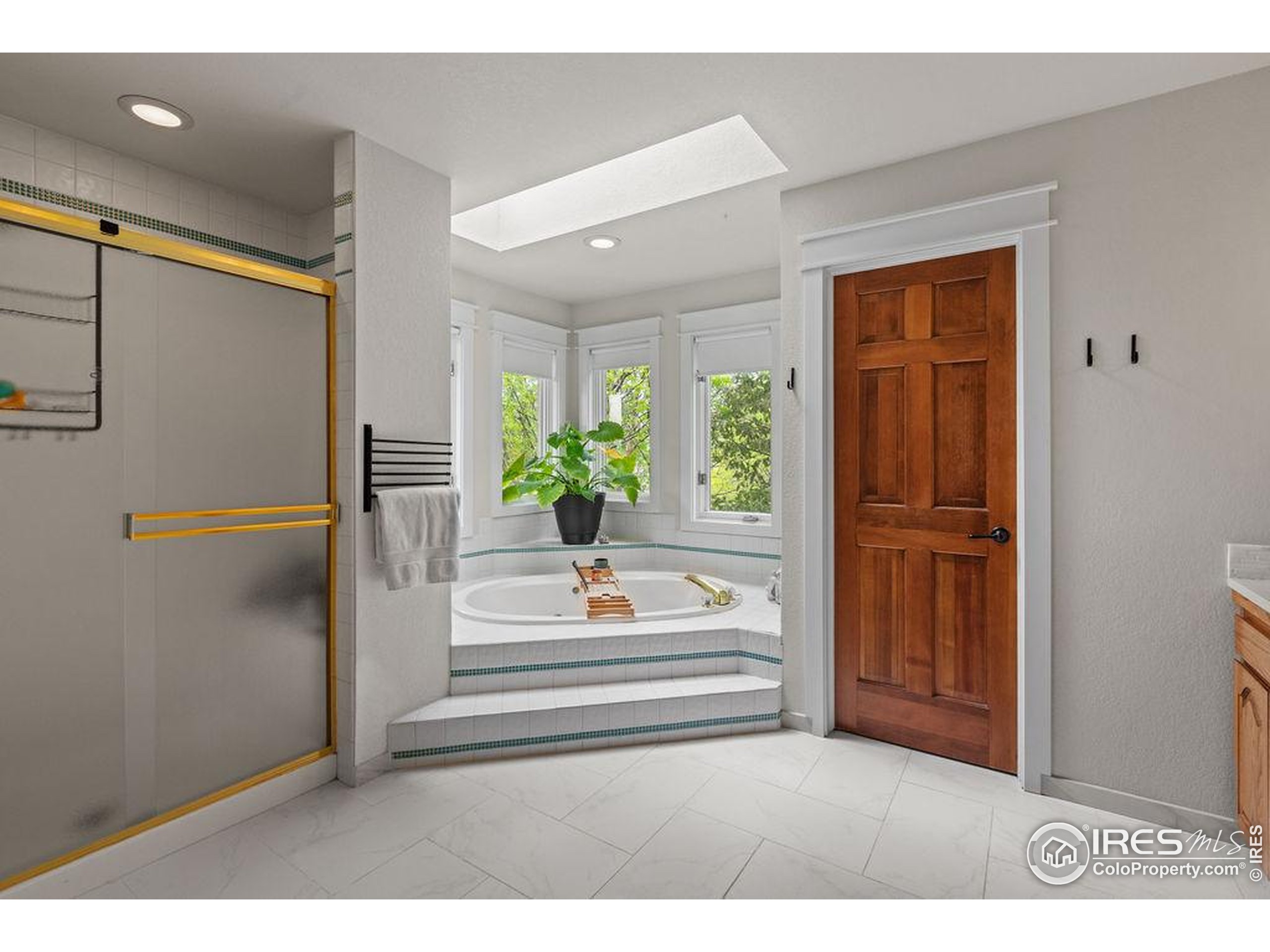 2213 Grosvenor Court Fort Collins, CO 80526 - Photo 23 of 40 a backyard of a house with wooden floor and a refrigerator