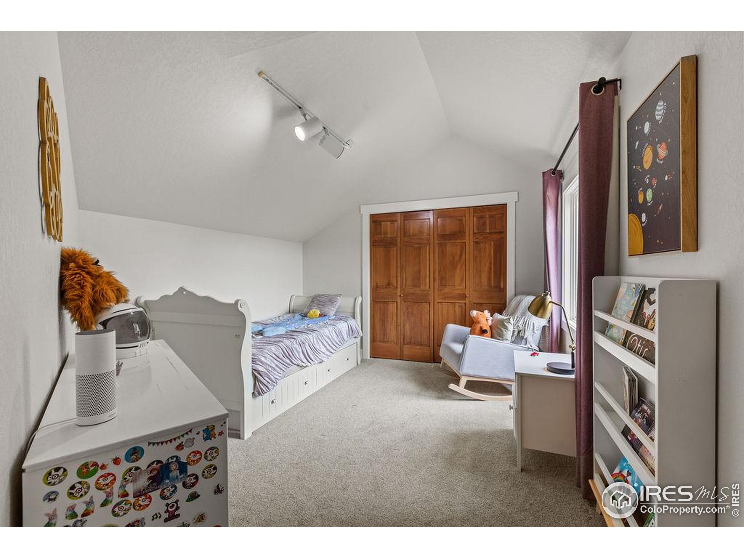 2213 Grosvenor Court Fort Collins, CO 80526 - Photo 27 of 40 a bedroom with furniture and a large window