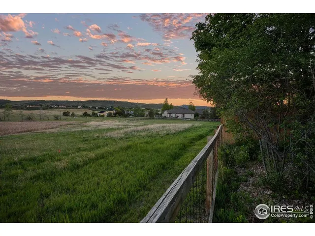 a view of backyard with outdoor seating and mountain view