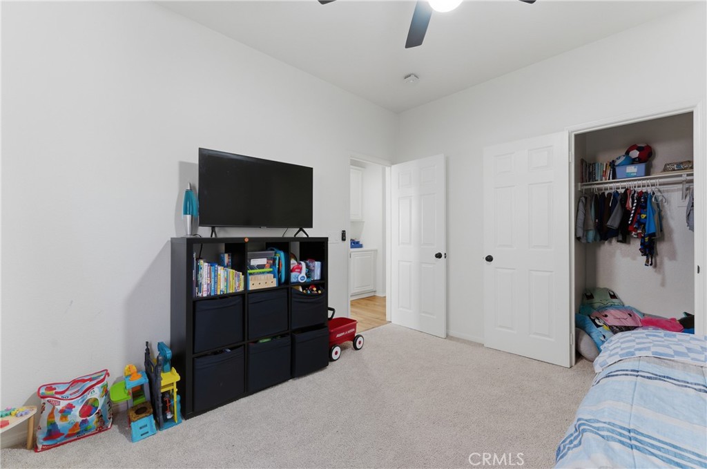 2036 East Jenner Street Lancaster, CA 93535 - Photo 24 of 50 a living room with furniture and a flat screen tv