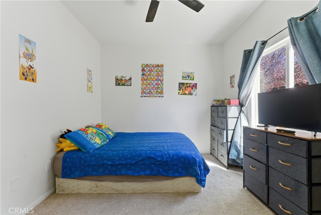2036 East Jenner Street Lancaster, CA 93535 - Photo 43 of 50 a bedroom with a bed and furniture