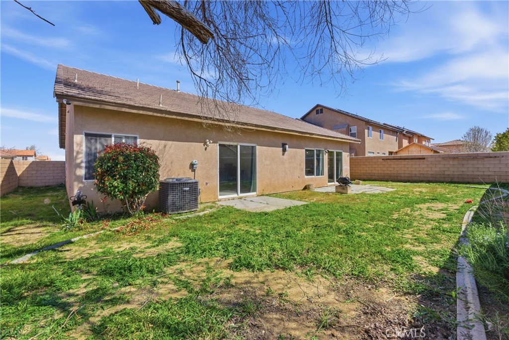 2036 East Jenner Street Lancaster, CA 93535 - Photo 48 of 50 a view of a house with a yard and plants