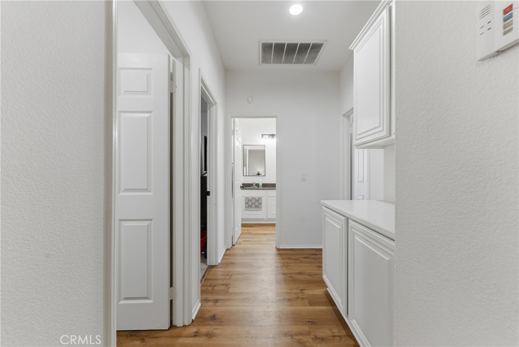 2036 East Jenner Street Lancaster, CA 93535 - Photo 9 of 50 a view of a hallway with the wooden floor