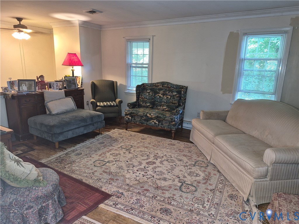3818 Cedar Grove Road Richmond, VA 23235 - Photo 7 of 20 a living room with furniture and a fireplace