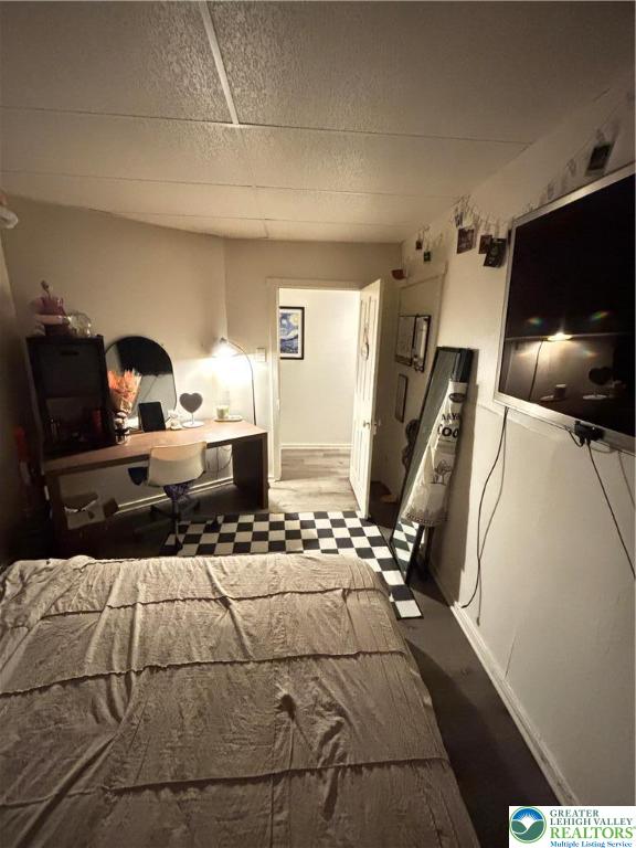 4731 Vera Cruz Road, Unit 6 Emmaus, PA 18049 - Photo 12 of 16 a bedroom with a bed and flat tv screen on the dresser