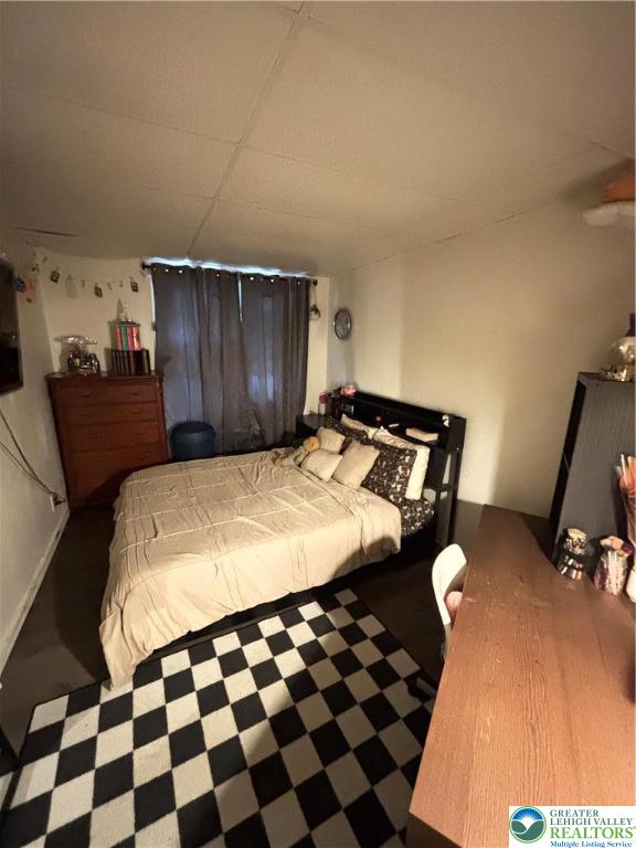 4731 Vera Cruz Road, Unit 6 Emmaus, PA 18049 - Photo 13 of 16 a bedroom with a bed and wooden floor