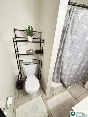 a bathroom with a toilet and a sink