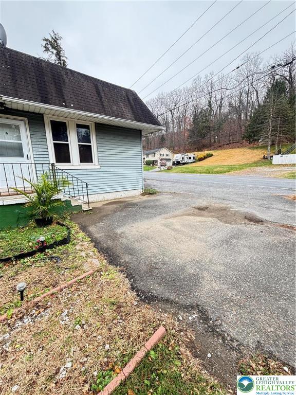 4731 Vera Cruz Road, Unit 6 Emmaus, PA 18049 - Photo 3 of 16 a view of a house with a swimming pool