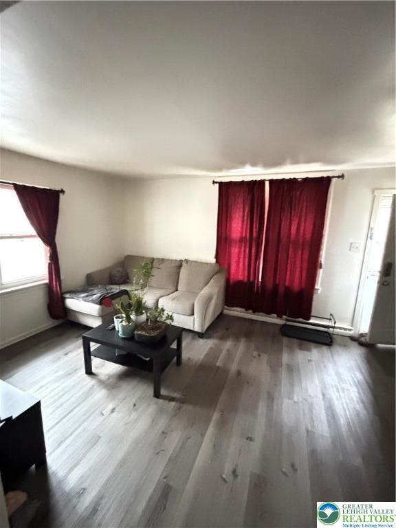 4731 Vera Cruz Road, Unit 6 Emmaus, PA 18049 - Photo 5 of 16 a living room with furniture and wooden floor