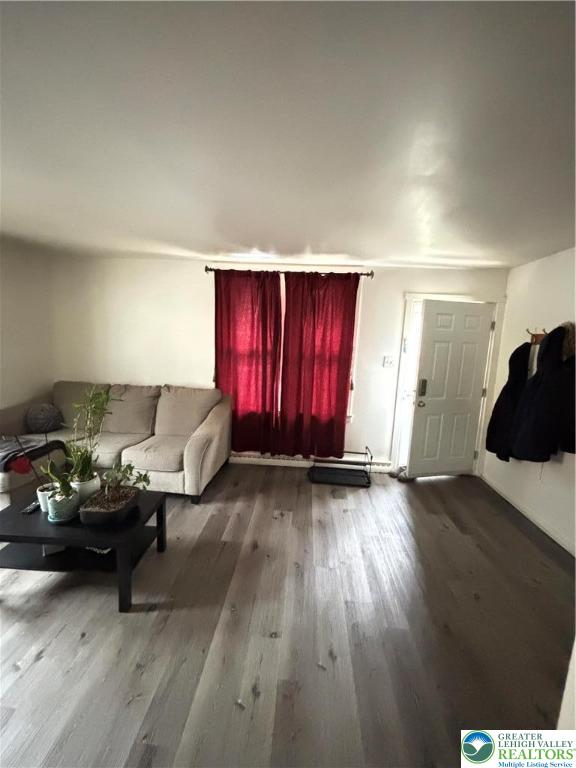 4731 Vera Cruz Road, Unit 6 Emmaus, PA 18049 - Photo 6 of 16 a living room with furniture window and wooden floor