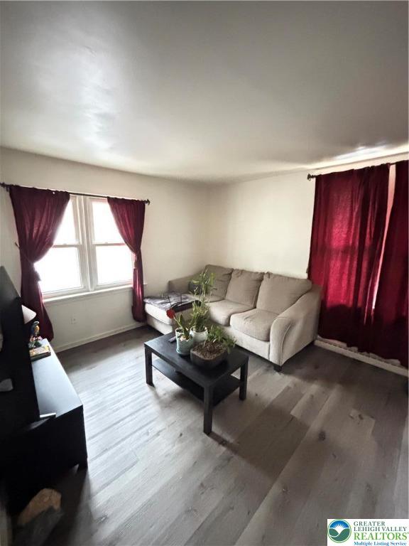 4731 Vera Cruz Road, Unit 6 Emmaus, PA 18049 - Photo 7 of 16 a living room with furniture and window