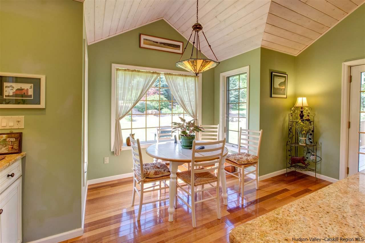 3135 Canada Hollow Road Andes, NY 13731 - Photo 12 of 33 a view of a dining room with furniture wooden floor and a chandelier