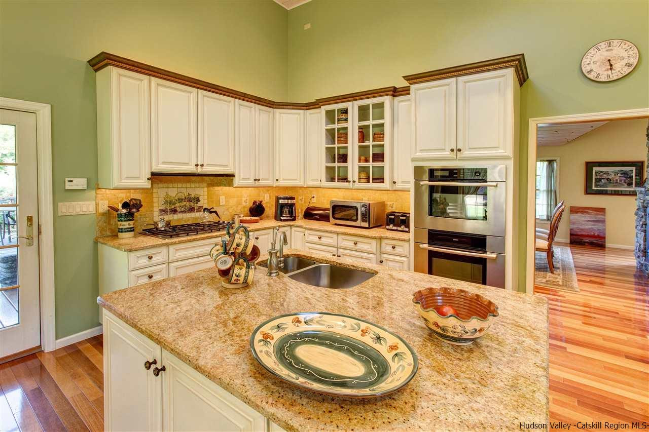 3135 Canada Hollow Road Andes, NY 13731 - Photo 14 of 33 a kitchen with wooden cabinets and appliances