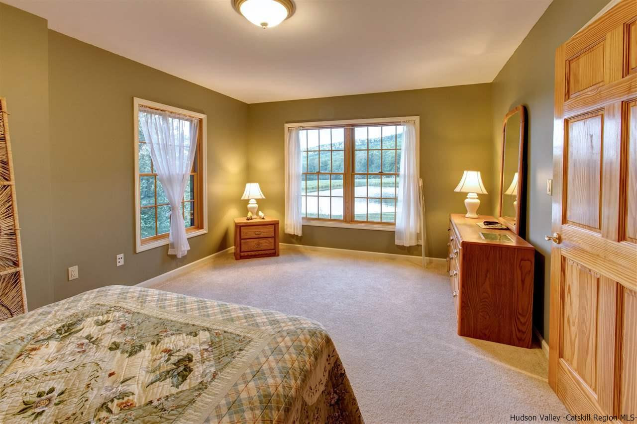 3135 Canada Hollow Road Andes, NY 13731 - Photo 22 of 33 a bedroom with a bed and wooden floor